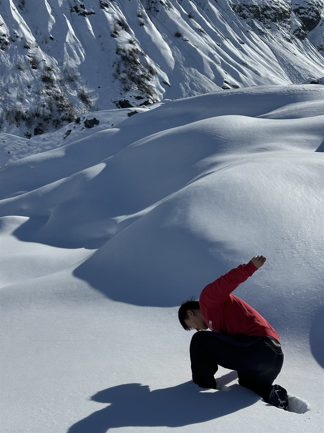 Person posing in an Alaska snowfield